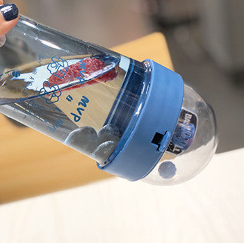 Beckett™ basketball-shaped water bottle with a black sports cap, designed for hydration during sports or outdoor activities.