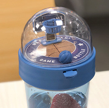Beckett™ basketball-shaped water bottle with a black lid and orange body, featuring basketball design details.