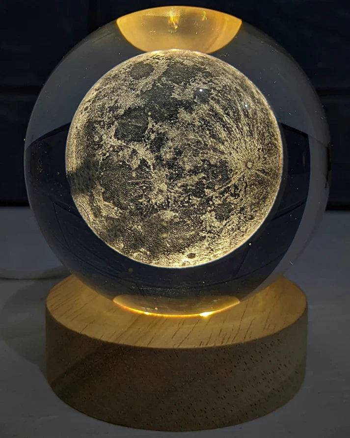 Beckett Galaxy Orb with swirling galaxy design, spherical shape, and vibrant cosmic colors on a reflective surface.