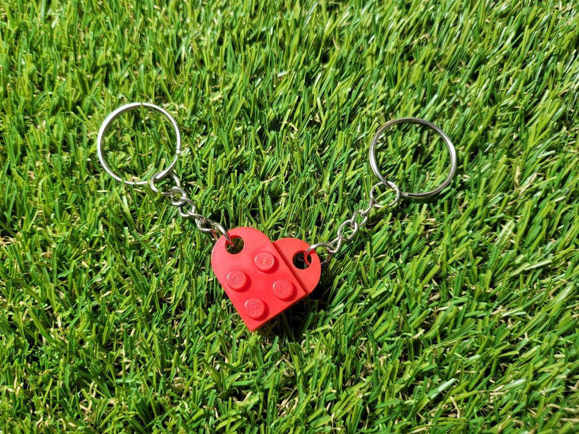Beckett Lego Love Charms featuring small, colorful Lego-inspired heart-shaped charms on a silver chain.