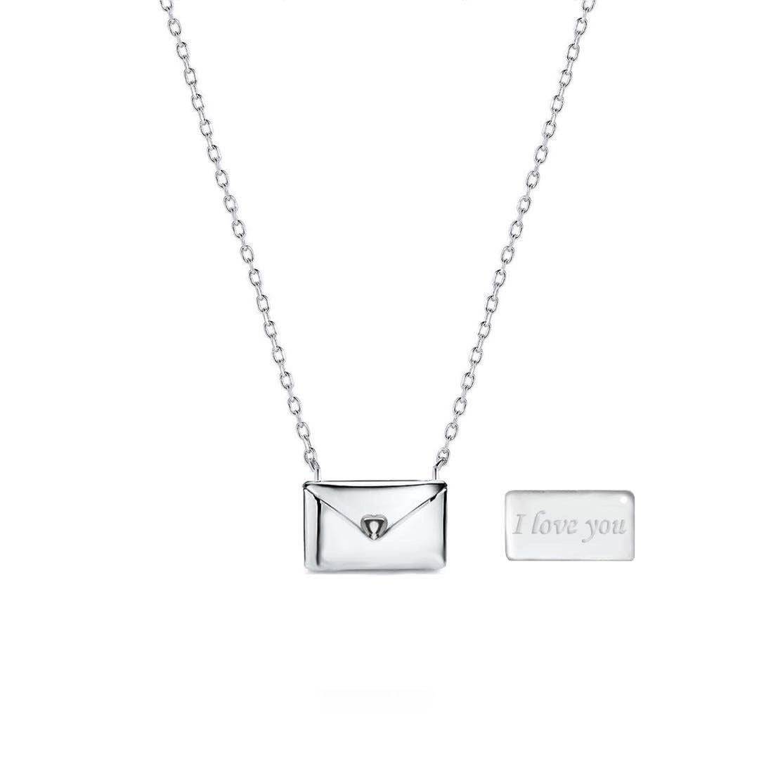 Beckett Envelope Pendant Necklace featuring a sleek silver envelope charm on a delicate chain.