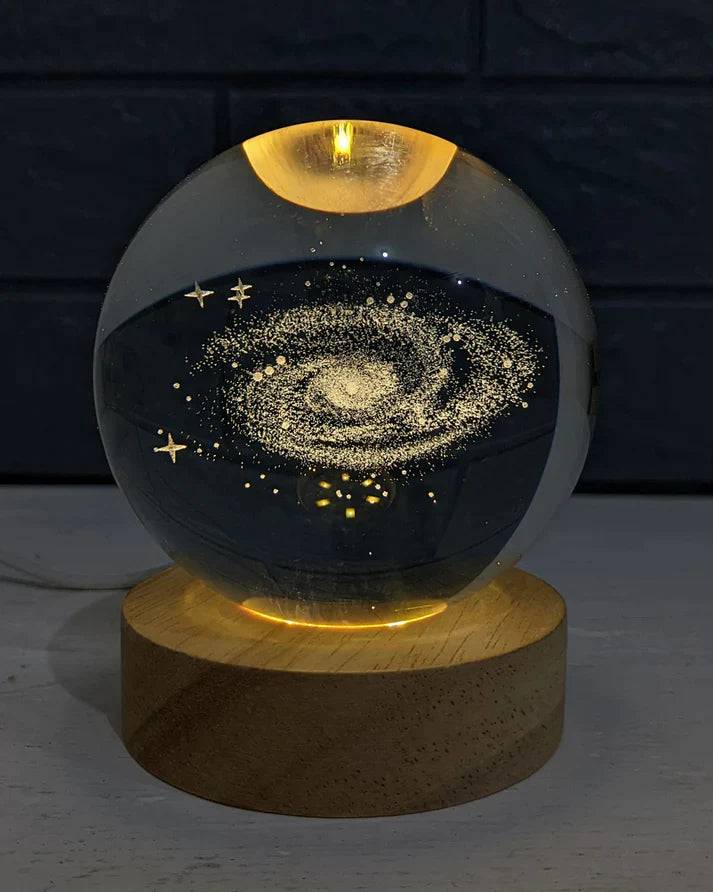 Beckett Galaxy Orb crystal ball with swirling galaxy design, spherical decorative glass ornament on a stand.