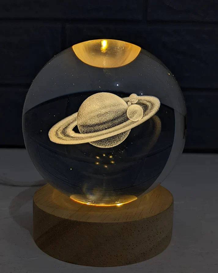 Beckett Galaxy Orb with swirling galaxy design, spherical decorative object, glossy surface, illuminated by soft light.