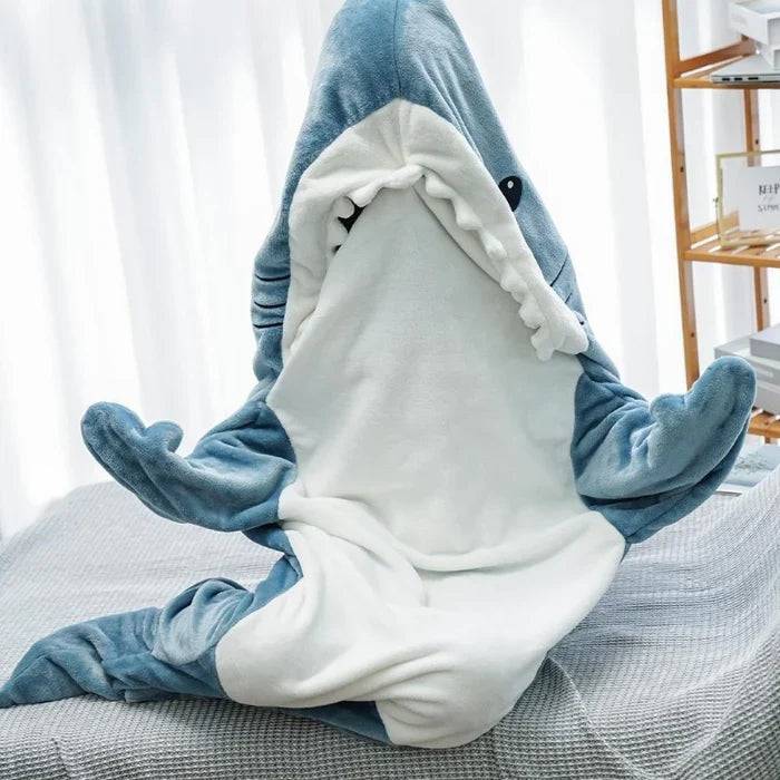 Beckett Shark onesie for kids, featuring a soft, playful shark design with hood and fins, perfect for cozy wear.